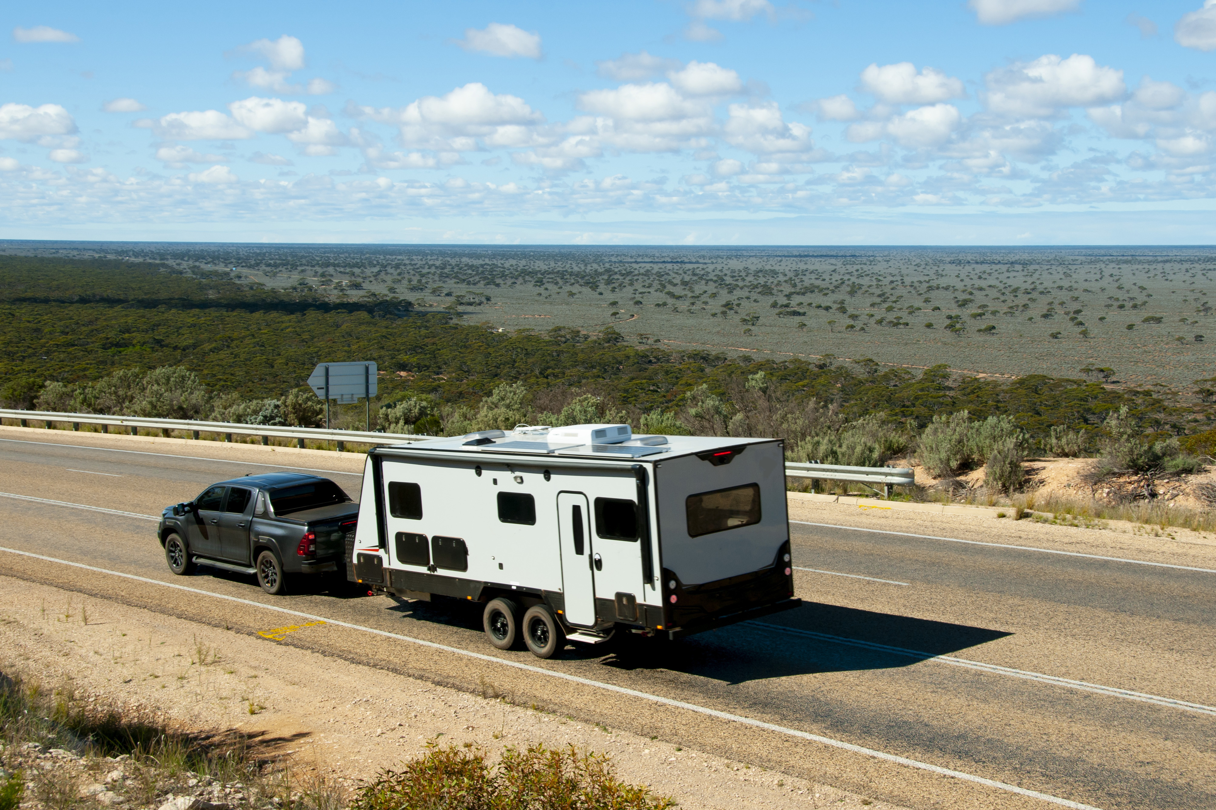 Luxury motorhome parked near mountains